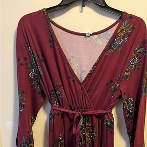 Floor length floral pattern dress.